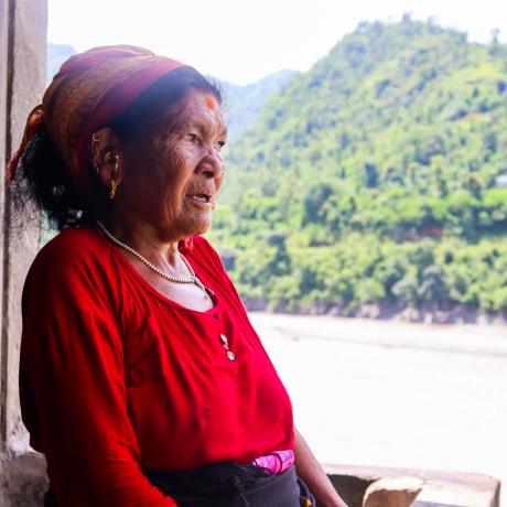 Nanimaya Senchuri looking at what is left after the devastating floods destroyed farmlands in her village