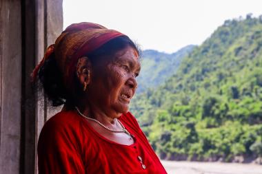 Nanimaya Senchuri looking at what is left after the devastating floods destroyed farmlands in her village